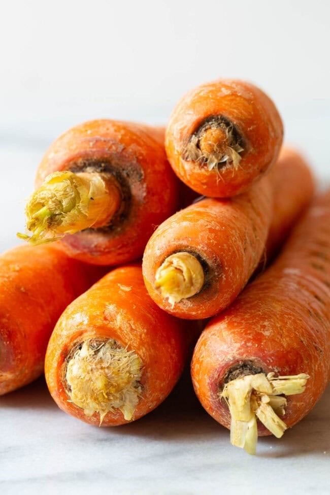 carrot recipes Carrots stacked on top of each other.