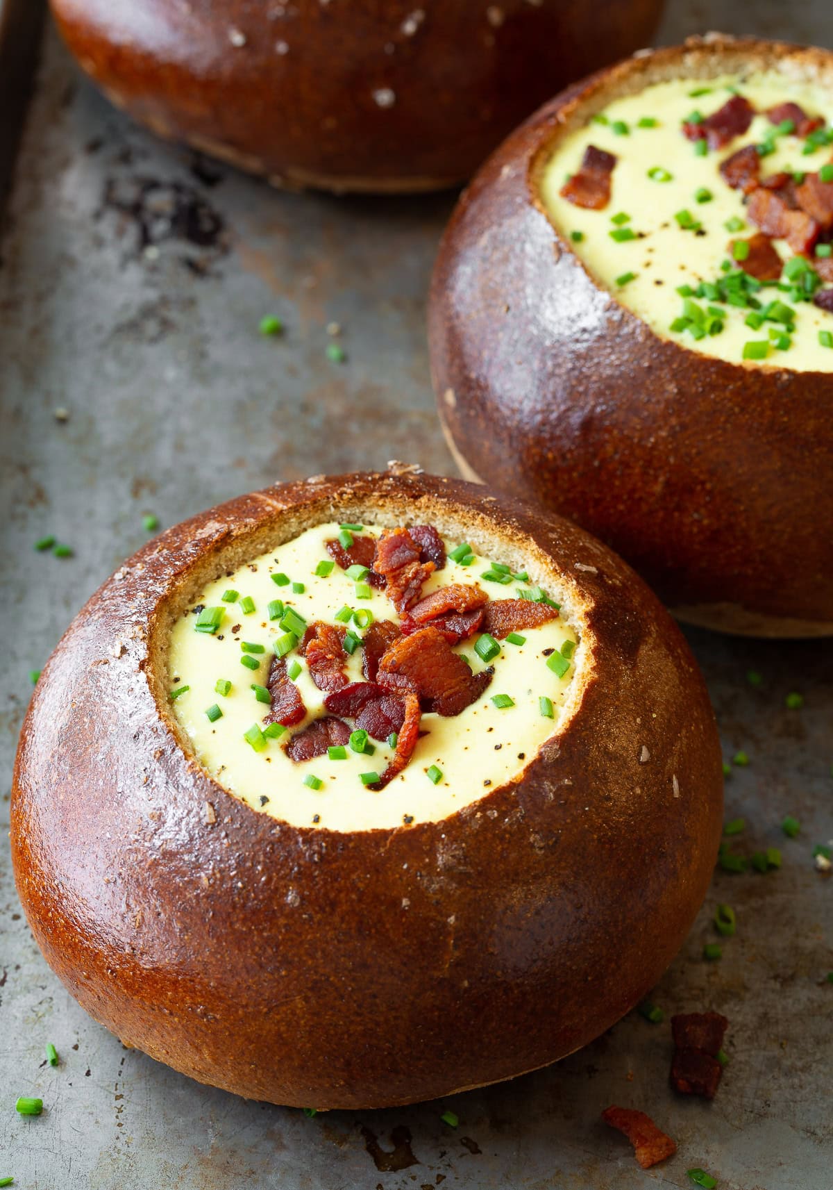 Bread bowls filled with creamy Irish beer cheese soup.