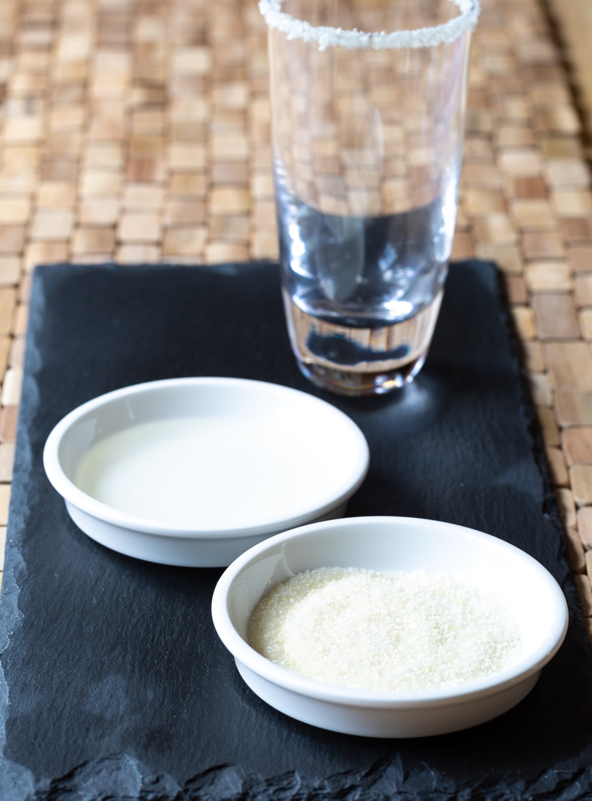 Margarita #ASpicyPerspective #Margarita #MargaritaRecipe #BestMargaritaRecipe #HowtoMakeaMargarita #Drink #Tequila #CincodeMayo #ClassicMargarita #Margaritas #Mexican #Cocktails Sauce dishes with lime juice and salt in them to salt the rim of a glass.