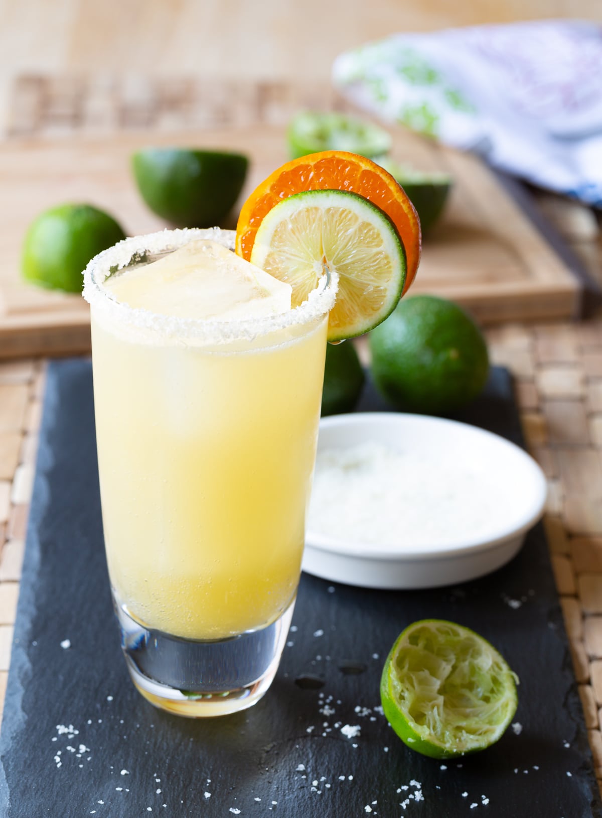 Margarita Recipe #ASpicyPerspective #Margarita #MargaritaRecipe #BestMargaritaRecipe #HowtoMakeaMargarita #Drink #Tequila #CincodeMayo #ClassicMargarita #Margaritas #Mexican #Cocktails Margarita served in a glass with salt on the rim and citrus garnishes.