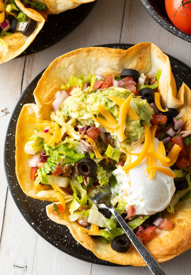 Crispy Tortilla Bow served with taco salad inside.