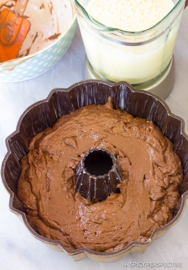 Chocolate cake batter in a bundt cake pan.