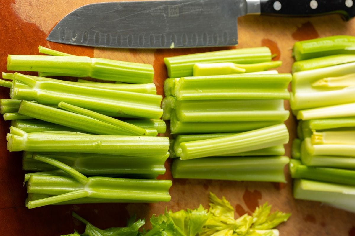 Chopped Celery on a cutting board.