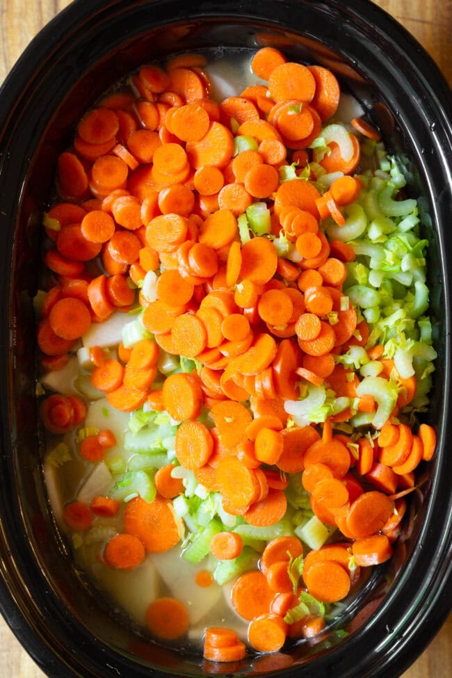 Carrots and Celery #ASpicyPerspective #CrockpotPotatoSoup #Chicken #Potato #Soup #Healthy #SlowCooker #Crockpot #PotatoSoup #PotatoSoupRecipe #DairyFree #GlutenFree #LowFat All vegetables in slow cooker for crockpot soup recipes
