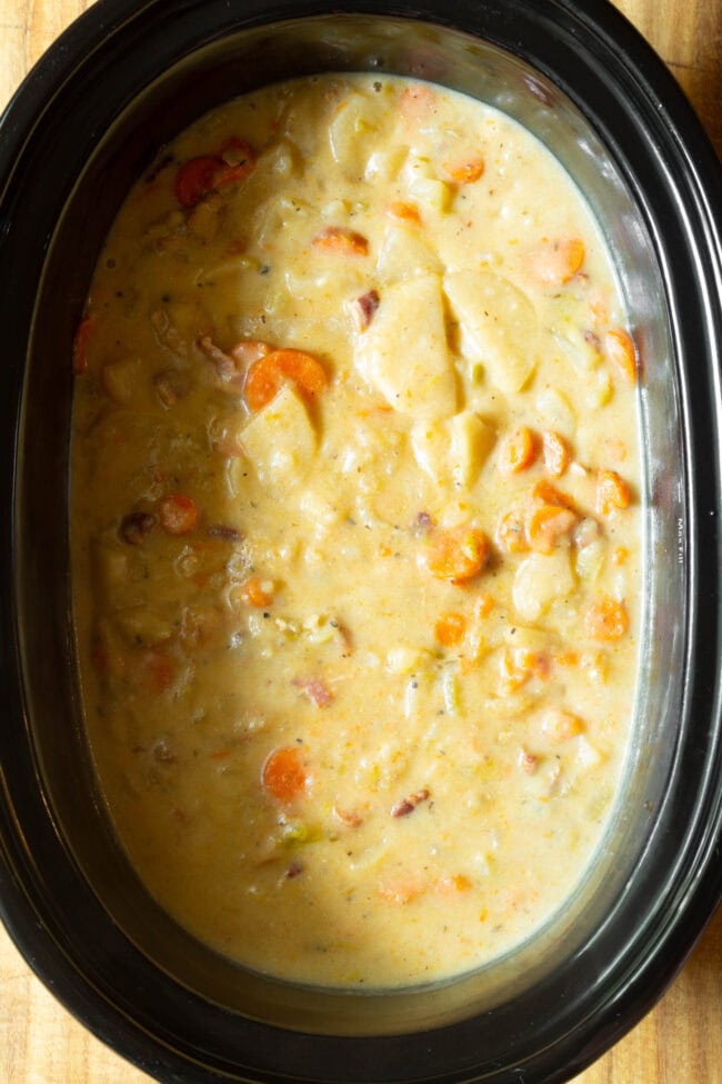 Potato Soup Recipe #ASpicyPerspective #CrockpotPotatoSoup #Chicken #Potato #Soup #Healthy #SlowCooker #Crockpot #PotatoSoup #PotatoSoupRecipe #DairyFree #GlutenFree #LowFat Overhead view of finished potato soup in slow cooker.