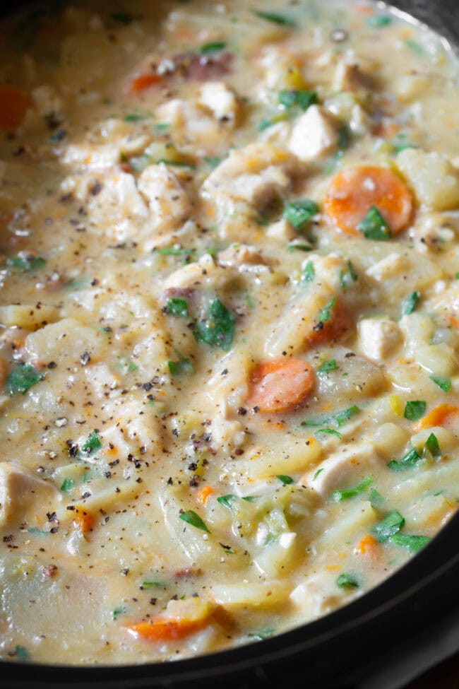 Crockpot Potato Soup #ASpicyPerspective #CrockpotPotatoSoup #Chicken #Potato #Soup #Healthy #SlowCooker #Crockpot #PotatoSoup #PotatoSoupRecipe #DairyFree #GlutenFree #LowFat Slow cooker potato chicken soup in the crock pot after cooking.