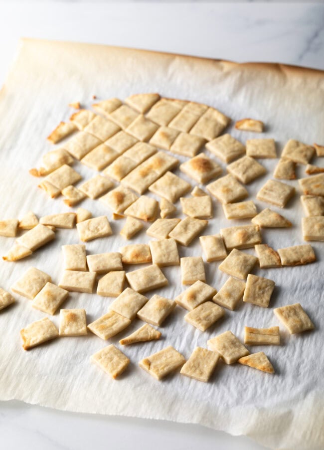 Pile of communion bread cut into small squares.