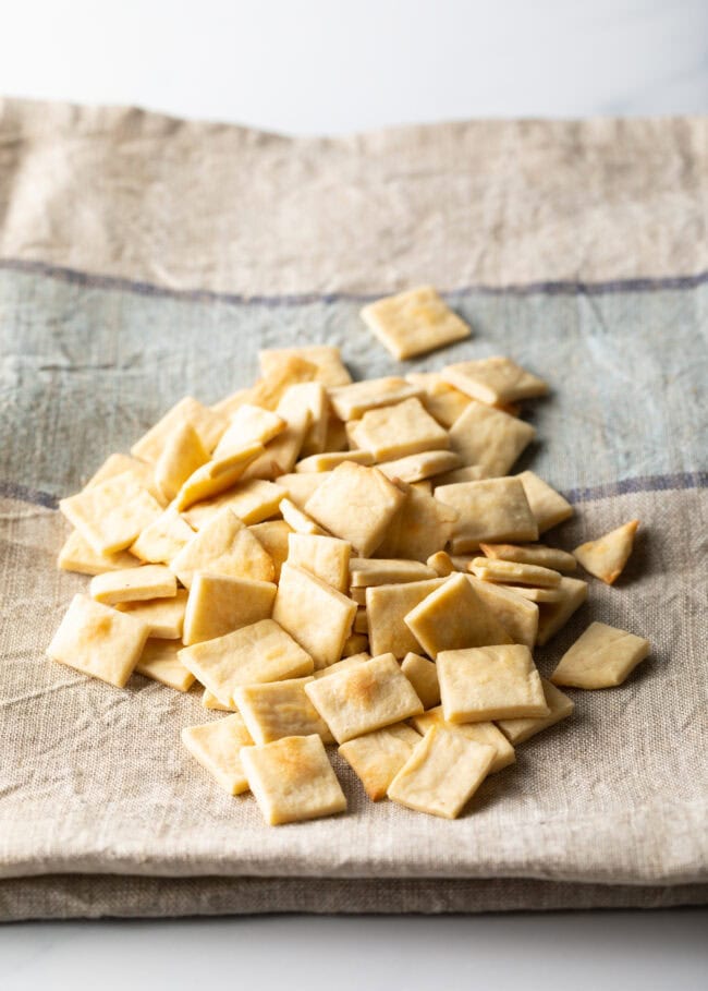 Pile of communion bread cut into small squares.