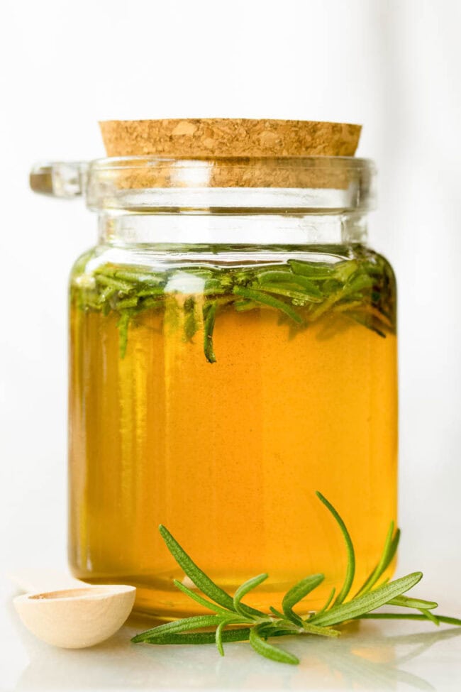 Sealed little glass jar of this spiced honey with rosemary in it.