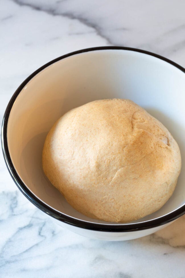 Let the dough ball rise in the bowl