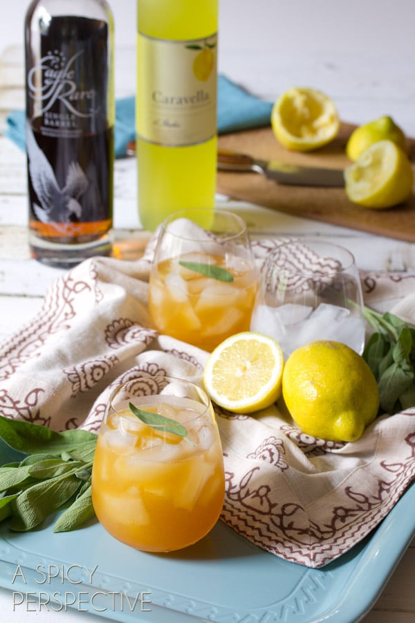 Bourbon Cocktails for summer on tray - Liimoncello and bourbon drink finished with sage leaves