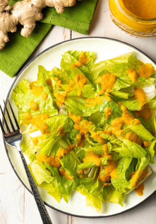 Simple lettuce salad with carrot ginger dressing.