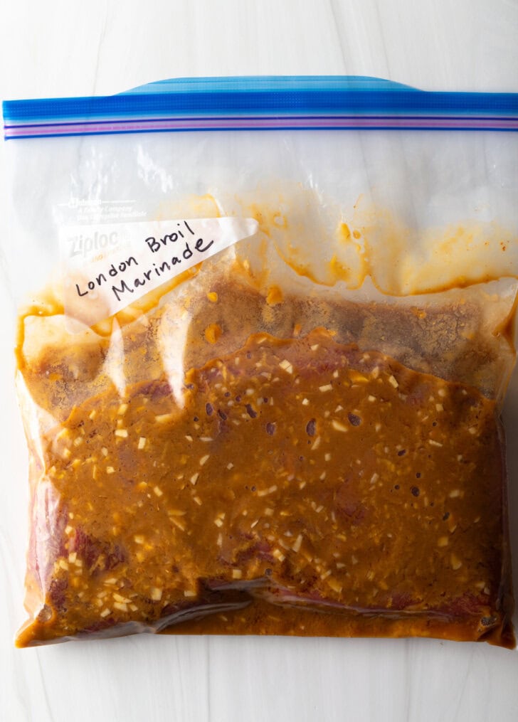 Plastic ziploc with seasoned brown marinade.