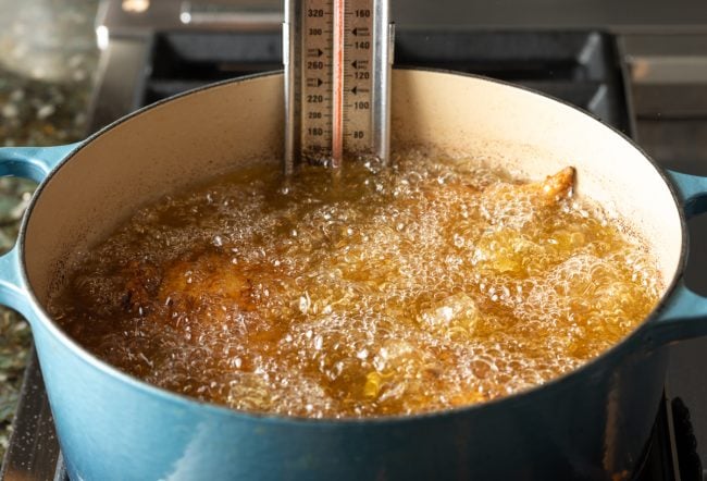 Hot oil on the stove top for frying chicken.