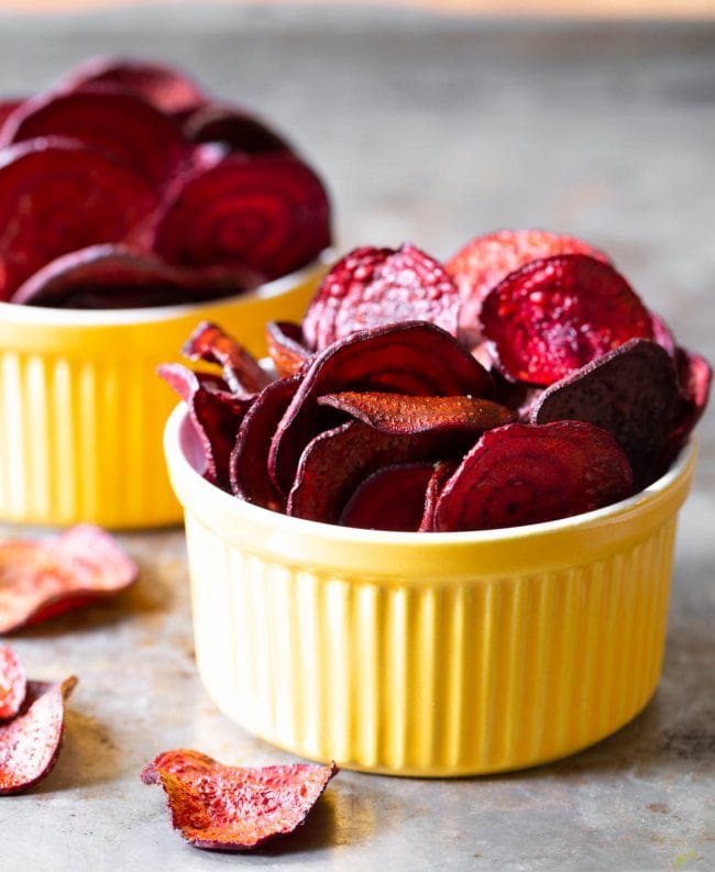 Final beet chips recipe looking crispy and bright in yellow bowls.