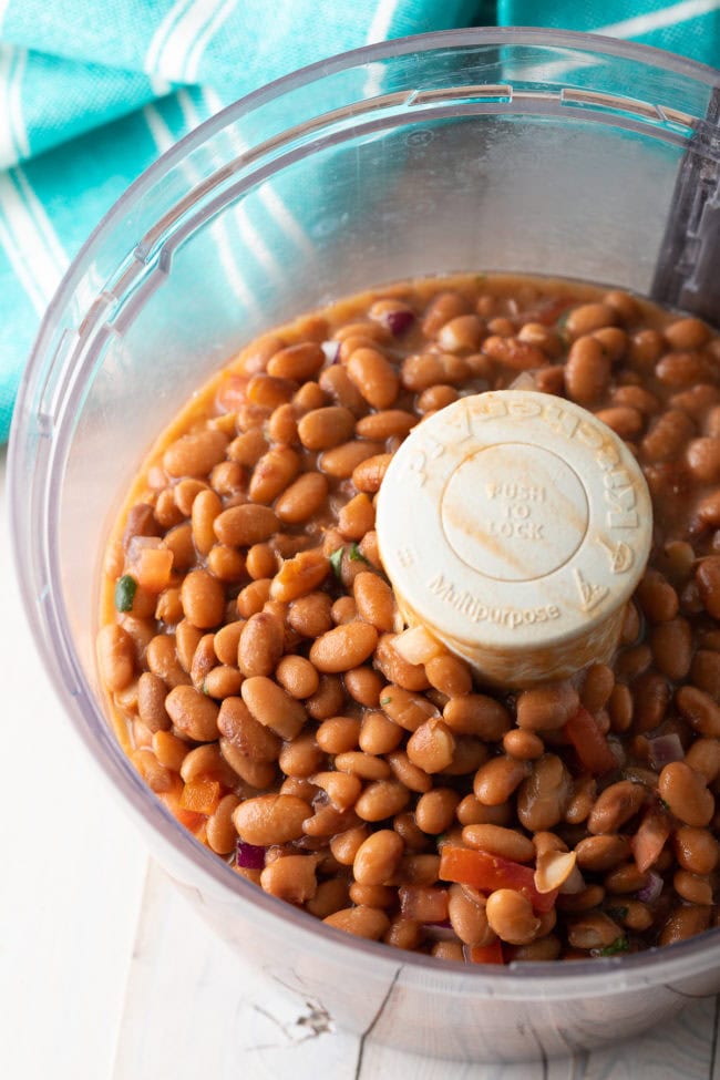 Beans in a food processor before being blended.