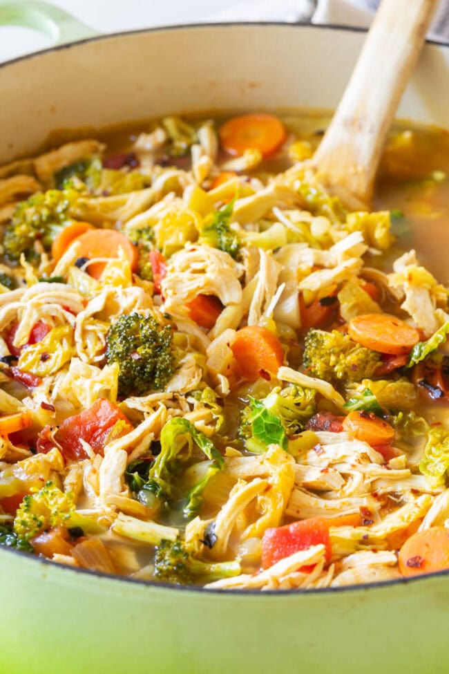 Southwest Chicken Detox Soup Recipe #ASpicyPerspective #Cleanse #Detox #Diet #Soup #Chicken Detox chicken soup with lots of fresh veggies in a pot.