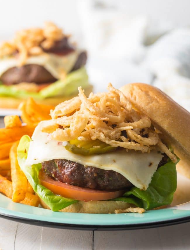 Cowboy Burger Recipe shown open face with lots of fried onions